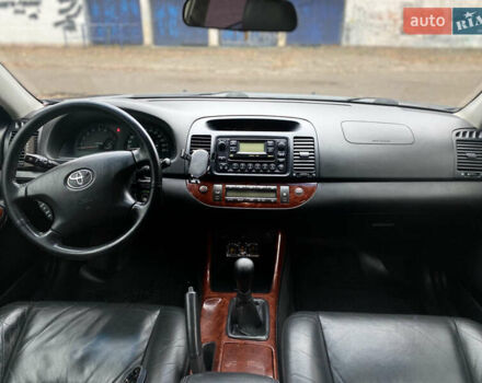 Чорний Тойота Камрі, об'ємом двигуна 2.4 л та пробігом 201 тис. км за 6999 $, фото 23 на Automoto.ua