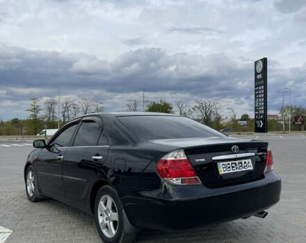 Черный Тойота Камри, объемом двигателя 2.4 л и пробегом 225 тыс. км за 7500 $, фото 7 на Automoto.ua