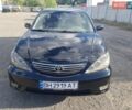 Черный Тойота Камри, объемом двигателя 2.36 л и пробегом 320 тыс. км за 4700 $, фото 1 на Automoto.ua