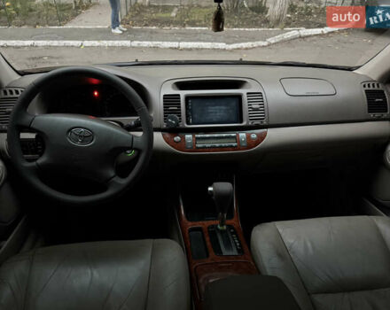 Черный Тойота Камри, объемом двигателя 2.36 л и пробегом 353 тыс. км за 6500 $, фото 27 на Automoto.ua