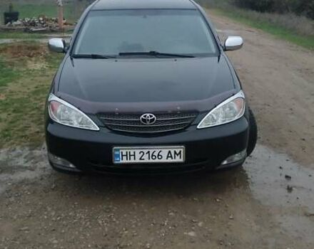 Черный Тойота Камри, объемом двигателя 2.4 л и пробегом 290 тыс. км за 7000 $, фото 7 на Automoto.ua