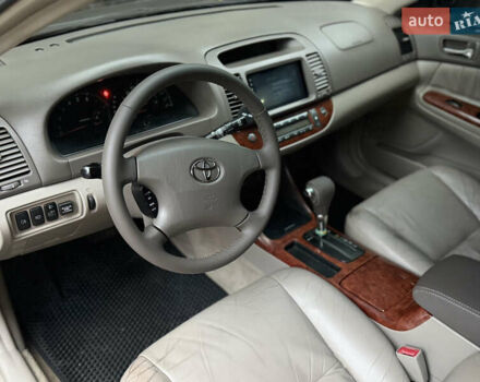 Черный Тойота Камри, объемом двигателя 2.36 л и пробегом 353 тыс. км за 6500 $, фото 18 на Automoto.ua