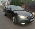 Черный Тойота Камри, объемом двигателя 2.4 л и пробегом 250 тыс. км за 5500 $, фото 2 на Automoto.ua
