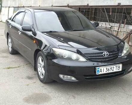 Чорний Тойота Камрі, об'ємом двигуна 2.4 л та пробігом 300 тис. км за 6500 $, фото 1 на Automoto.ua