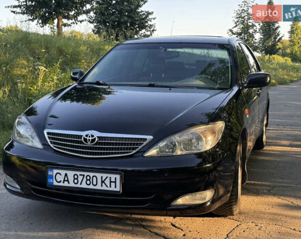 Черный Тойота Камри, объемом двигателя 2.36 л и пробегом 356 тыс. км за 5800 $, фото 1 на Automoto.ua