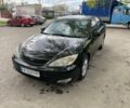 Черный Тойота Камри, объемом двигателя 2.4 л и пробегом 371 тыс. км за 5250 $, фото 1 на Automoto.ua