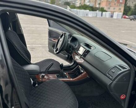 Черный Тойота Камри, объемом двигателя 2.4 л и пробегом 375 тыс. км за 5000 $, фото 7 на Automoto.ua