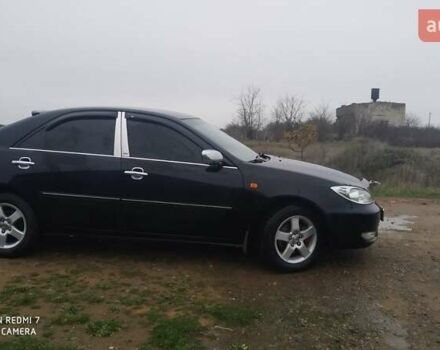 Черный Тойота Камри, объемом двигателя 2.4 л и пробегом 290 тыс. км за 7000 $, фото 1 на Automoto.ua