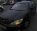 Черный Тойота Камри, объемом двигателя 2.4 л и пробегом 275 тыс. км за 4800 $, фото 1 на Automoto.ua