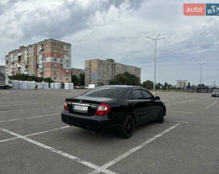 Черный Тойота Камри, объемом двигателя 2.4 л и пробегом 375 тыс. км за 5000 $, фото 3 на Automoto.ua