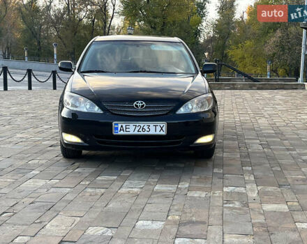 Черный Тойота Камри, объемом двигателя 2.4 л и пробегом 325 тыс. км за 4500 $, фото 1 на Automoto.ua