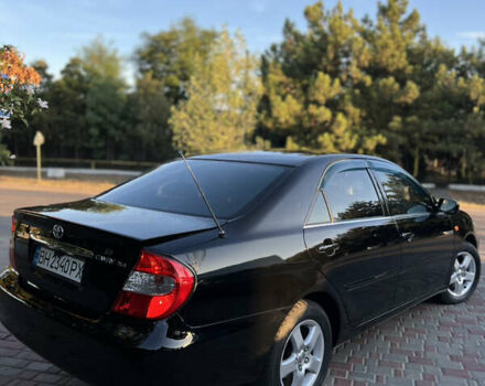 Черный Тойота Камри, объемом двигателя 2.4 л и пробегом 268 тыс. км за 5750 $, фото 62 на Automoto.ua