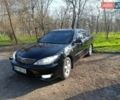 Черный Тойота Камри, объемом двигателя 3 л и пробегом 450 тыс. км за 7100 $, фото 1 на Automoto.ua
