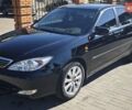 Чорний Тойота Камрі, об'ємом двигуна 2.36 л та пробігом 375 тис. км за 7600 $, фото 1 на Automoto.ua