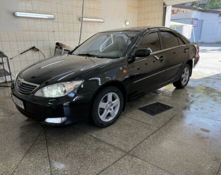 Черный Тойота Камри, объемом двигателя 2.4 л и пробегом 400 тыс. км за 2900 $, фото 1 на Automoto.ua