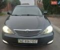 Чорний Тойота Камрі, об'ємом двигуна 2.4 л та пробігом 294 тис. км за 5200 $, фото 1 на Automoto.ua