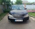 Черный Тойота Камри, объемом двигателя 3 л и пробегом 236 тыс. км за 4500 $, фото 1 на Automoto.ua
