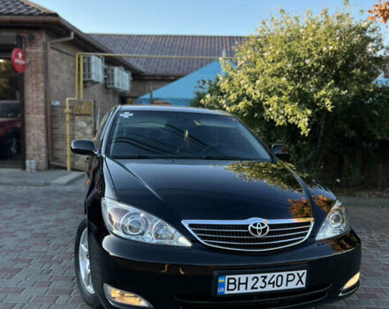 Черный Тойота Камри, объемом двигателя 2.4 л и пробегом 268 тыс. км за 5750 $, фото 1 на Automoto.ua
