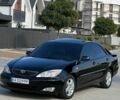Черный Тойота Камри, объемом двигателя 2.4 л и пробегом 300 тыс. км за 6000 $, фото 1 на Automoto.ua