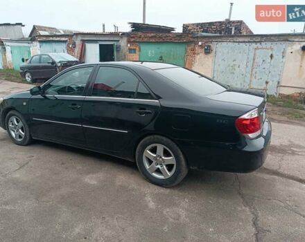 Черный Тойота Камри, объемом двигателя 3 л и пробегом 370 тыс. км за 4500 $, фото 5 на Automoto.ua