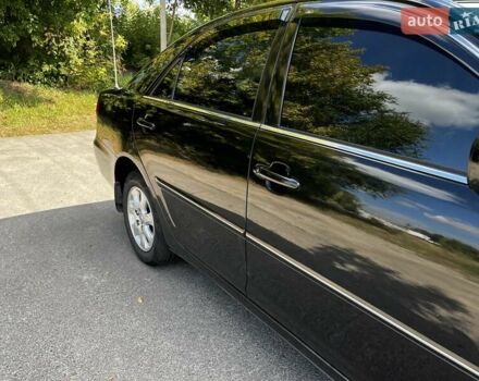 Черный Тойота Камри, объемом двигателя 2.37 л и пробегом 437 тыс. км за 6400 $, фото 10 на Automoto.ua