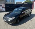 Черный Тойота Камри, объемом двигателя 2.4 л и пробегом 310 тыс. км за 4850 $, фото 1 на Automoto.ua