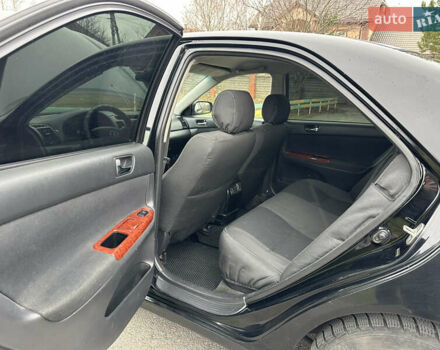 Черный Тойота Камри, объемом двигателя 2.4 л и пробегом 553 тыс. км за 5100 $, фото 9 на Automoto.ua