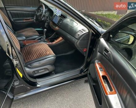 Черный Тойота Камри, объемом двигателя 2.37 л и пробегом 437 тыс. км за 6400 $, фото 24 на Automoto.ua