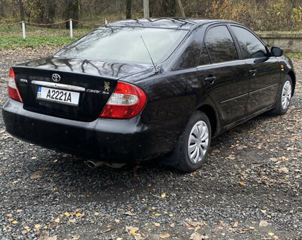 Чорний Тойота Камрі, об'ємом двигуна 2.4 л та пробігом 310 тис. км за 5600 $, фото 5 на Automoto.ua