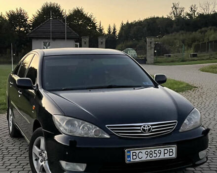 Черный Тойота Камри, объемом двигателя 2.4 л и пробегом 317 тыс. км за 5650 $, фото 1 на Automoto.ua