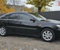 Тойота Камри 2004 в Каменское - Днепродзержинск на Automoto.ua Черный Тойота Камри, объемом двигателя 2 л и пробегом 180 тыс. км за 6700 $, фото 6 на Automoto.ua