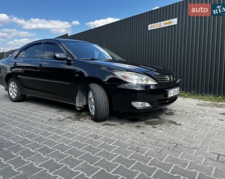 Черный Тойота Камри, объемом двигателя 2.37 л и пробегом 437 тыс. км за 6400 $, фото 1 на Automoto.ua