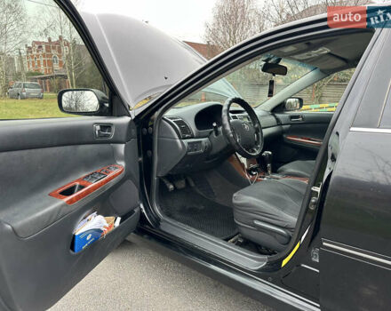 Черный Тойота Камри, объемом двигателя 2.4 л и пробегом 553 тыс. км за 5100 $, фото 10 на Automoto.ua