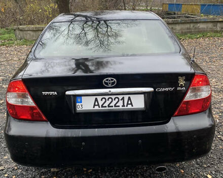 Чорний Тойота Камрі, об'ємом двигуна 2.4 л та пробігом 310 тис. км за 5600 $, фото 3 на Automoto.ua
