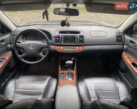 Чорний Тойота Камрі, об'ємом двигуна 2.4 л та пробігом 310 тис. км за 5600 $, фото 6 на Automoto.ua