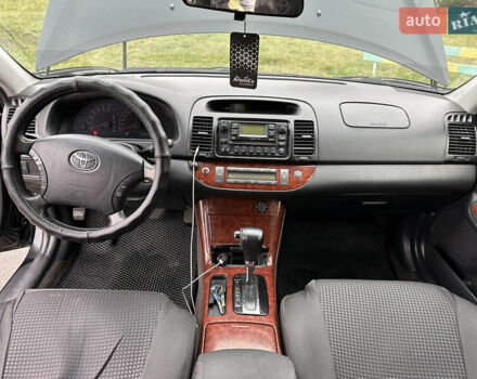 Черный Тойота Камри, объемом двигателя 2.4 л и пробегом 553 тыс. км за 5100 $, фото 11 на Automoto.ua