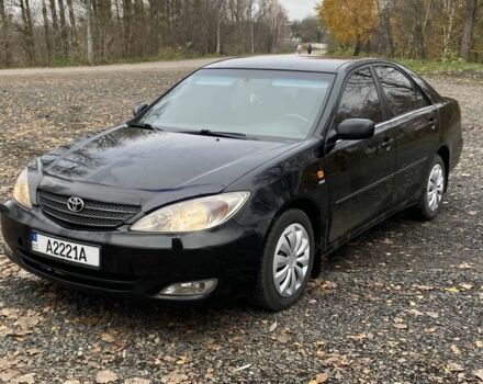 Черный Тойота Камри, объемом двигателя 2.4 л и пробегом 310 тыс. км за 5600 $, фото 2 на Automoto.ua