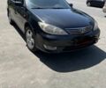 Черный Тойота Камри, объемом двигателя 2.4 л и пробегом 350 тыс. км за 5500 $, фото 1 на Automoto.ua