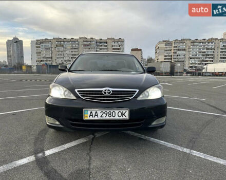 Черный Тойота Камри, объемом двигателя 2.4 л и пробегом 315 тыс. км за 5800 $, фото 1 на Automoto.ua