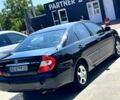 Черный Тойота Камри, объемом двигателя 2.4 л и пробегом 323 тыс. км за 5000 $, фото 1 на Automoto.ua