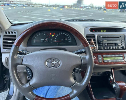 Черный Тойота Камри, объемом двигателя 2.4 л и пробегом 315 тыс. км за 5800 $, фото 13 на Automoto.ua