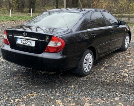 Черный Тойота Камри, объемом двигателя 2.4 л и пробегом 310 тыс. км за 5600 $, фото 5 на Automoto.ua