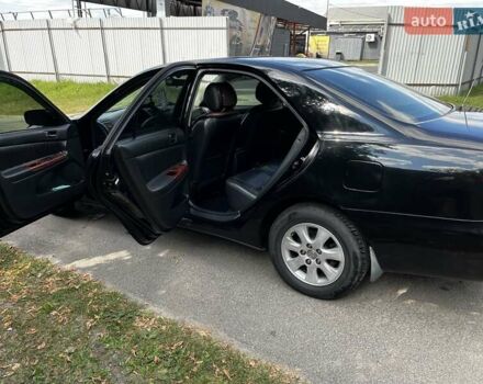 Черный Тойота Камри, объемом двигателя 2.37 л и пробегом 437 тыс. км за 6400 $, фото 18 на Automoto.ua