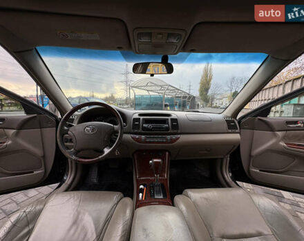 Черный Тойота Камри, объемом двигателя 2.4 л и пробегом 326 тыс. км за 6300 $, фото 22 на Automoto.ua