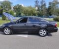 Черный Тойота Камри, объемом двигателя 2.4 л и пробегом 310 тыс. км за 6000 $, фото 1 на Automoto.ua