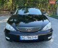 Чорний Тойота Камрі, об'ємом двигуна 2.4 л та пробігом 267 тис. км за 6900 $, фото 1 на Automoto.ua