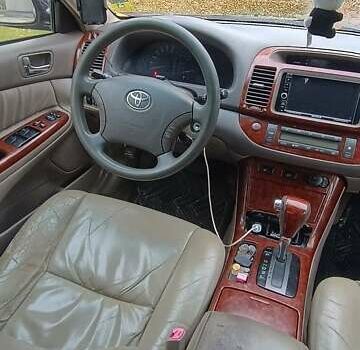 Чорний Тойота Камрі, об'ємом двигуна 2.4 л та пробігом 300 тис. км за 5500 $, фото 3 на Automoto.ua