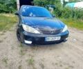 Черный Тойота Камри, объемом двигателя 3 л и пробегом 400 тыс. км за 3800 $, фото 1 на Automoto.ua