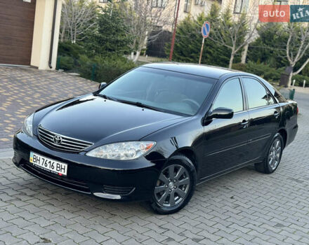 Черный Тойота Камри, объемом двигателя 2.36 л и пробегом 98 тыс. км за 8700 $, фото 1 на Automoto.ua