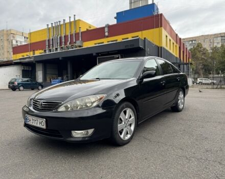Черный Тойота Камри, объемом двигателя 2.4 л и пробегом 180 тыс. км за 6000 $, фото 1 на Automoto.ua